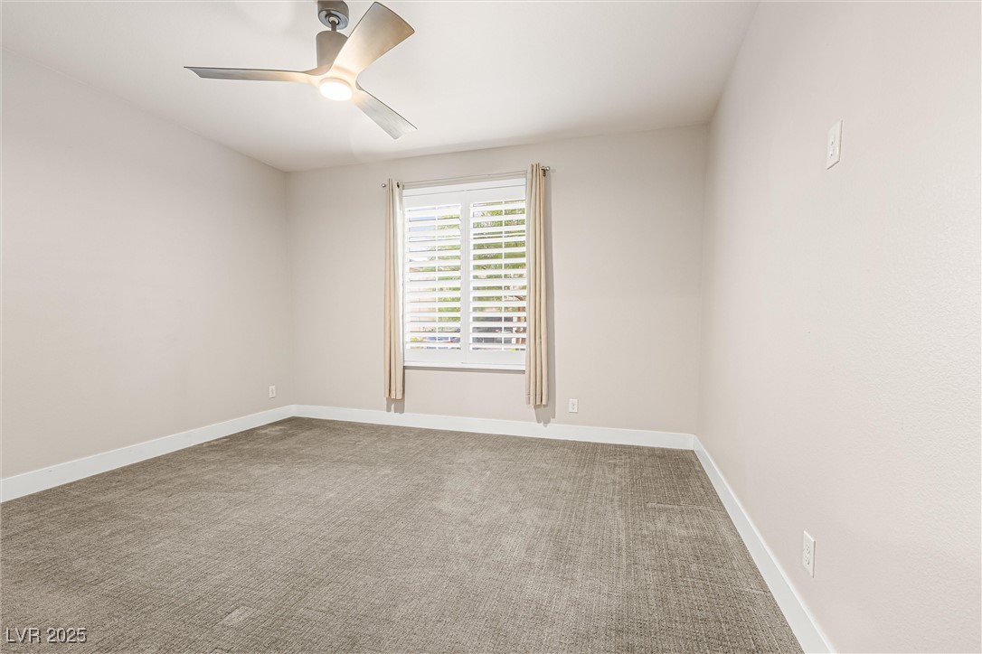 4631 Amazing View Street Las Vegas, NV 89129 - Photo 53 of 94 Carpeted empty room with baseboards and a ceiling fan