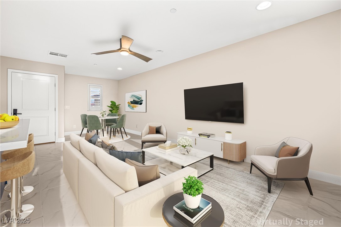 4631 Amazing View Street Las Vegas, NV 89129 - Photo 59 of 94 Living area featuring light marble finish floors, recessed lighting, and a ceiling fan