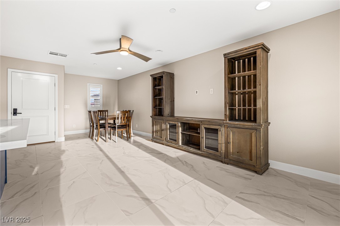 4631 Amazing View Street Las Vegas, NV 89129 - Photo 60 of 94 Dining room with light marble finish floors, recessed lighting, and ceiling fan