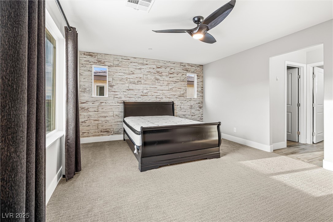 4631 Amazing View Street Las Vegas, NV 89129 - Photo 71 of 94 Bedroom with light colored carpet and ceiling fan