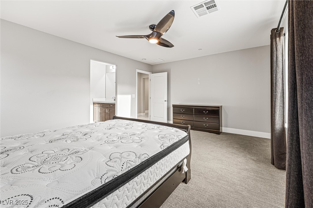 4631 Amazing View Street Las Vegas, NV 89129 - Photo 72 of 94 Bedroom with light carpet, ceiling fan, and ensuite bathroom