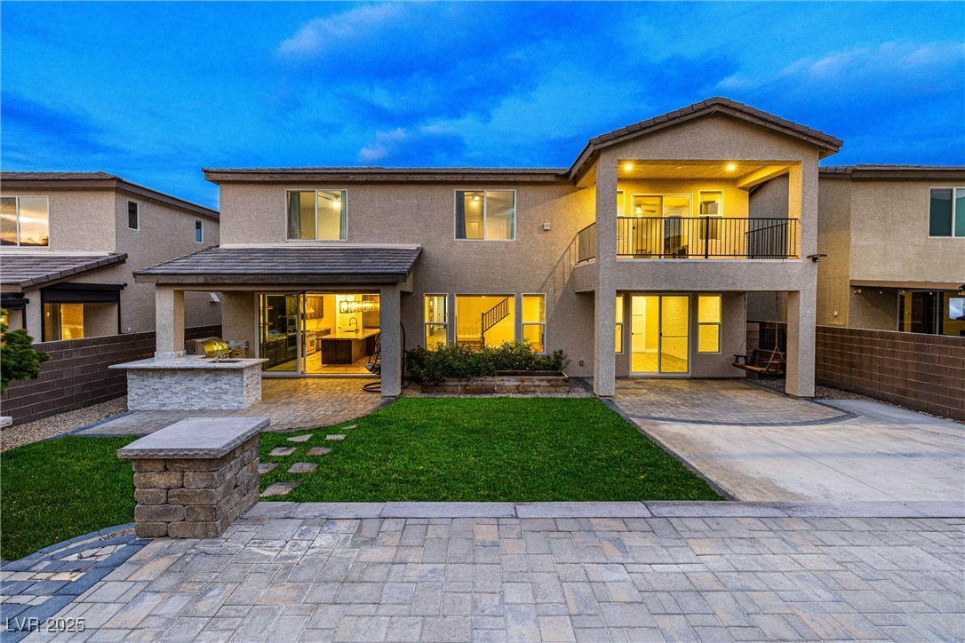4631 Amazing View Street Las Vegas, NV 89129 - Photo 8 of 94 Rear view of property featuring area for grilling, stucco siding, a balcony, and a patio