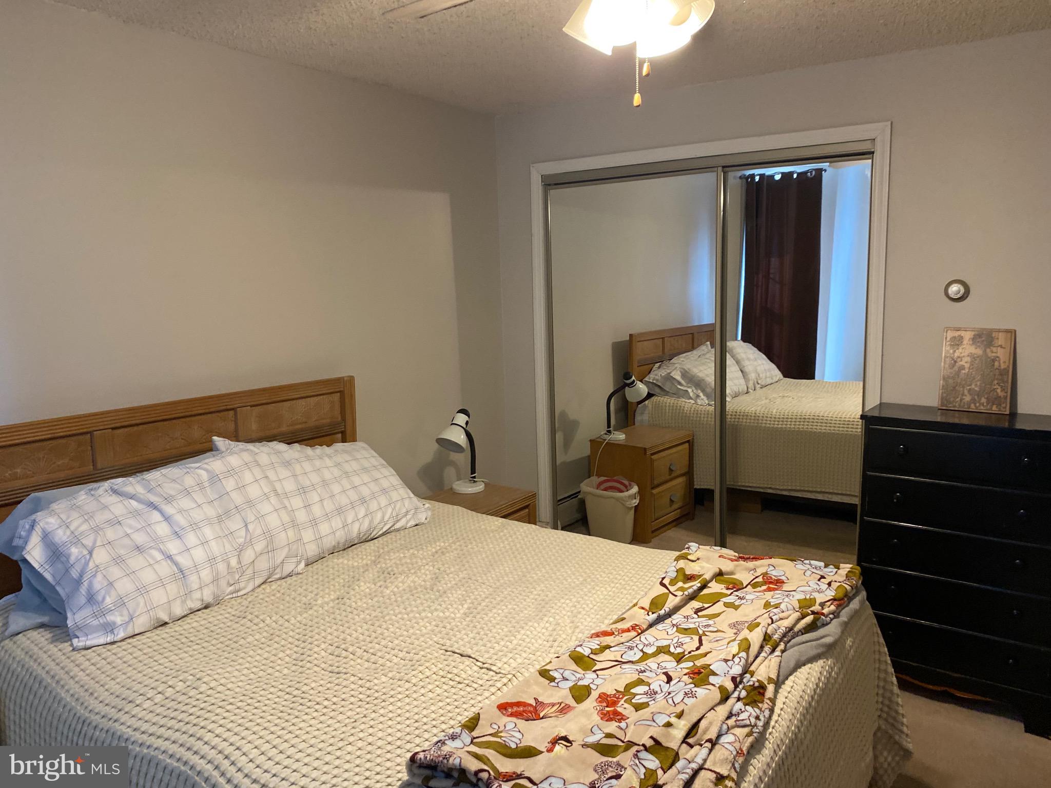 1026 Scott Street Kulpmont, PA 17834 - Photo 18 of 32 a bedroom with a bed and a mirror