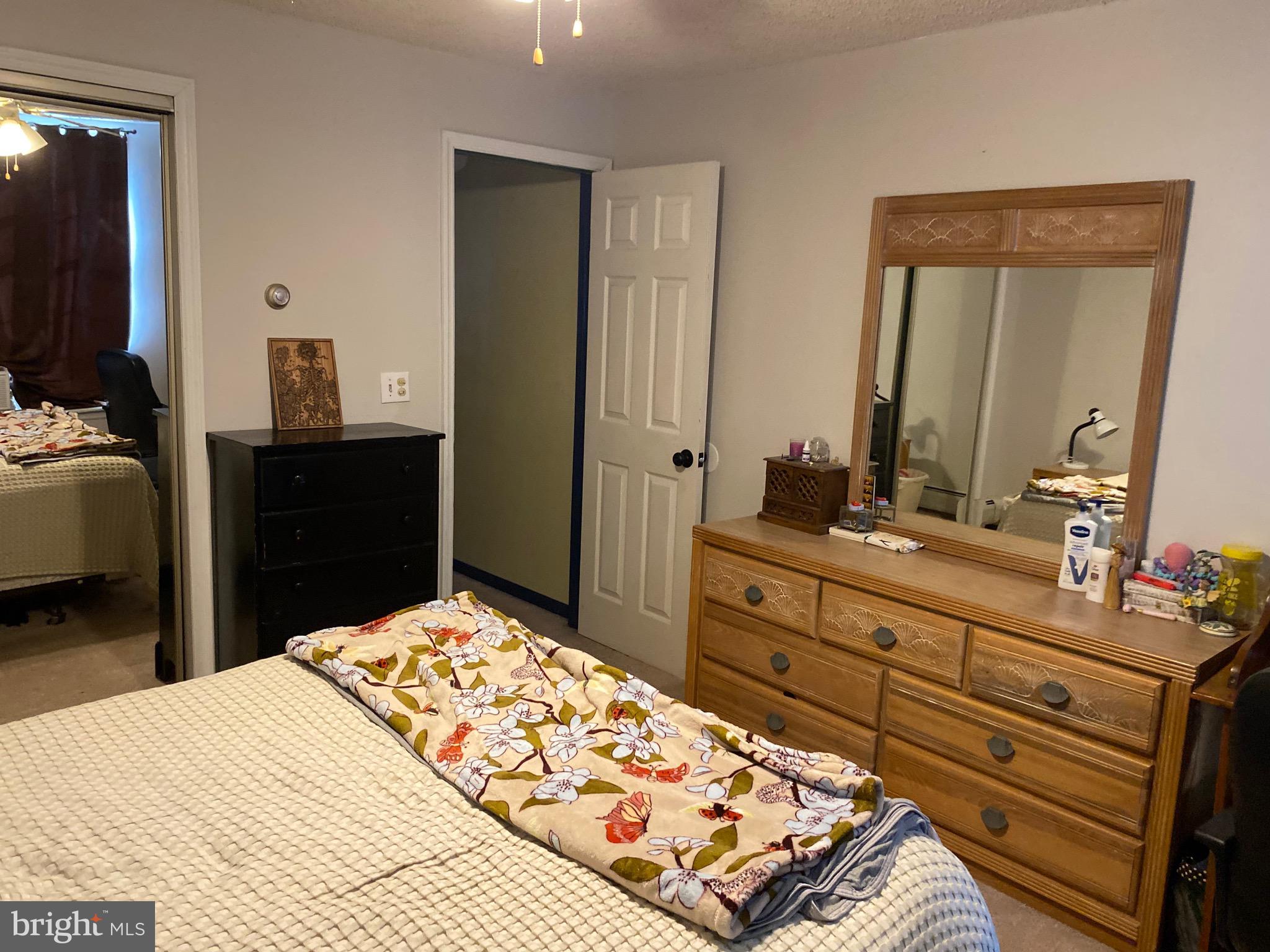 1026 Scott Street Kulpmont, PA 17834 - Photo 19 of 32 a bedroom with a bed and a dresser