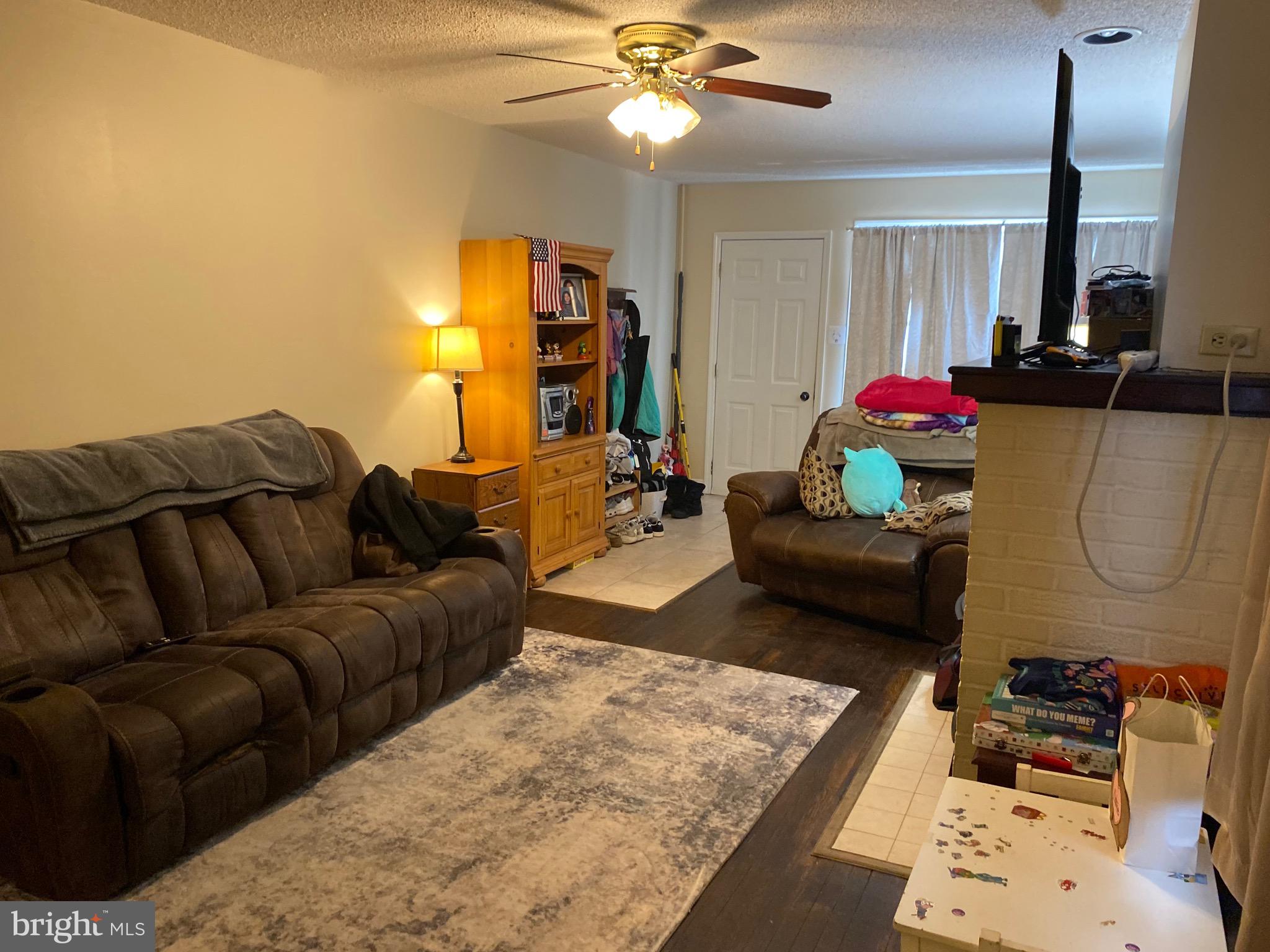1026 Scott Street Kulpmont, PA 17834 - Photo 2 of 32 a living room with furniture a window and a chandelier