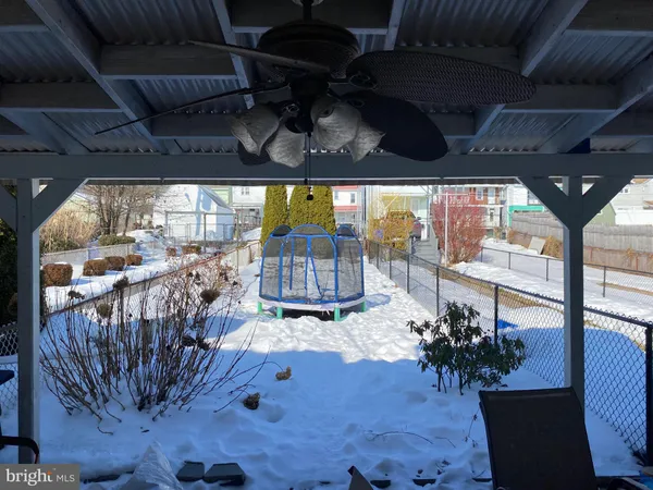a view of balcony with two chairs and a rug