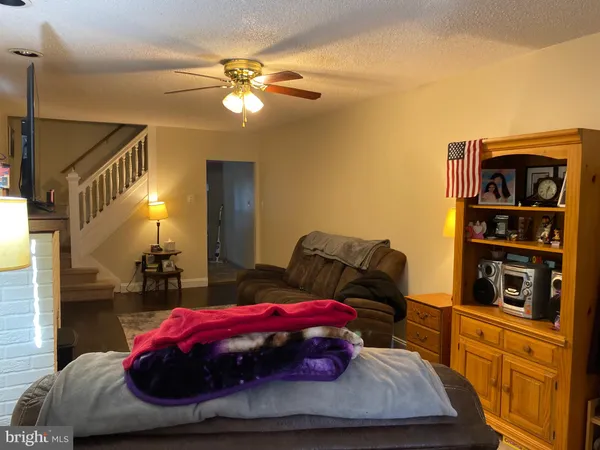 a bedroom with bed and cabinets
