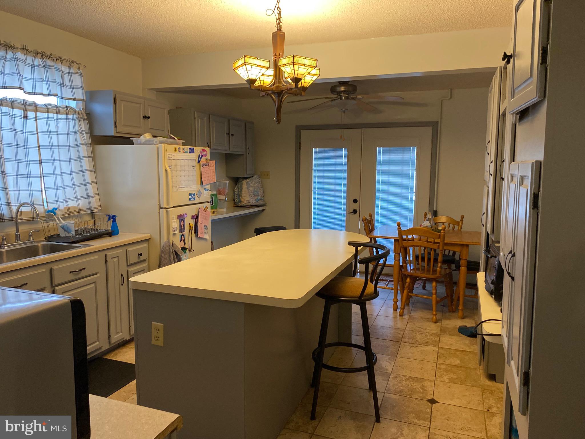1026 Scott Street Kulpmont, PA 17834 - Photo 10 of 32 a kitchen that has a table and chairs in it