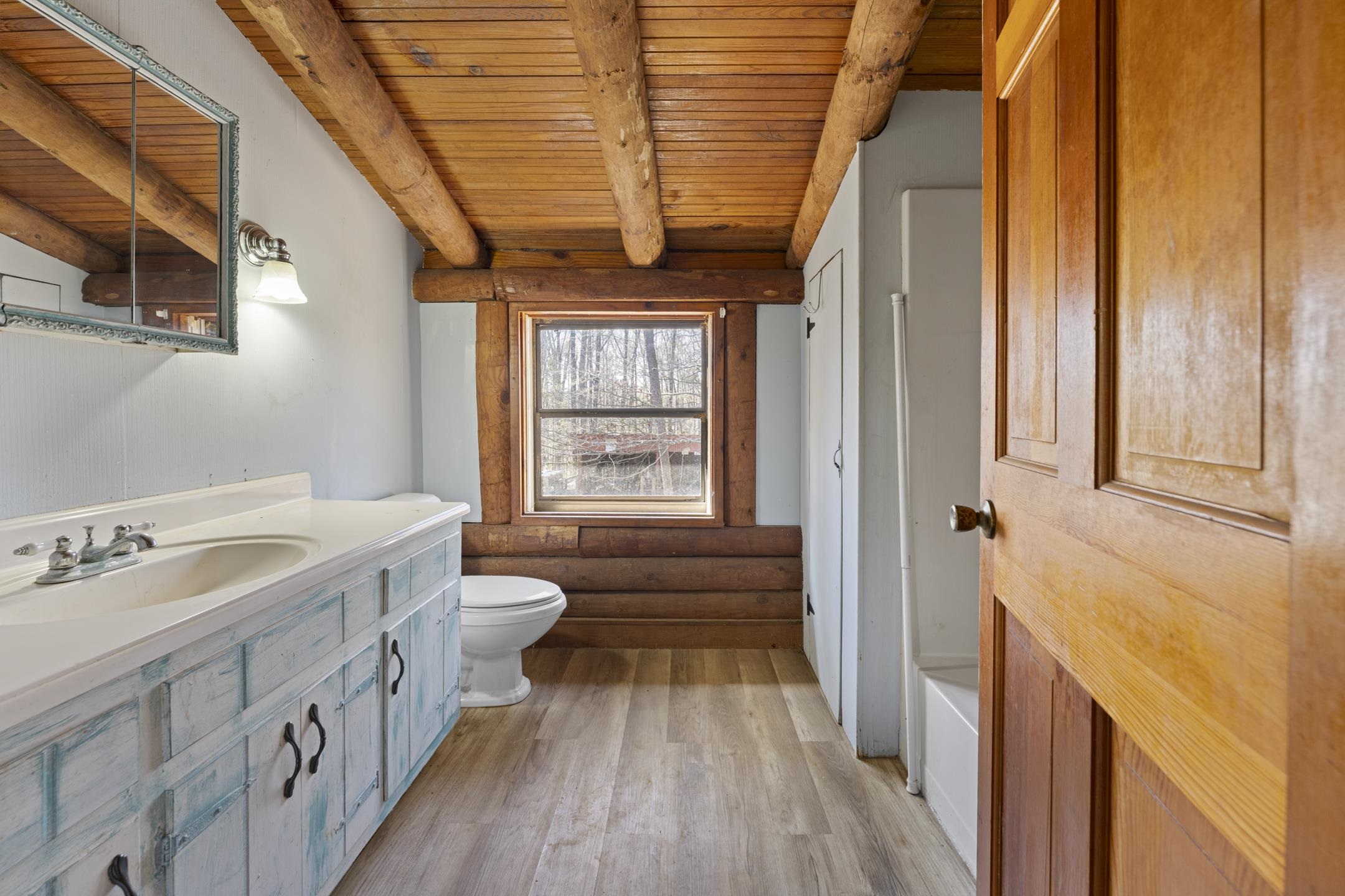 7285 Peavine Road Middleton, TN 38052 - Photo 19 of 35 Bathroom with vanity, toilet, wood ceiling, wood finished floors, and beam ceiling