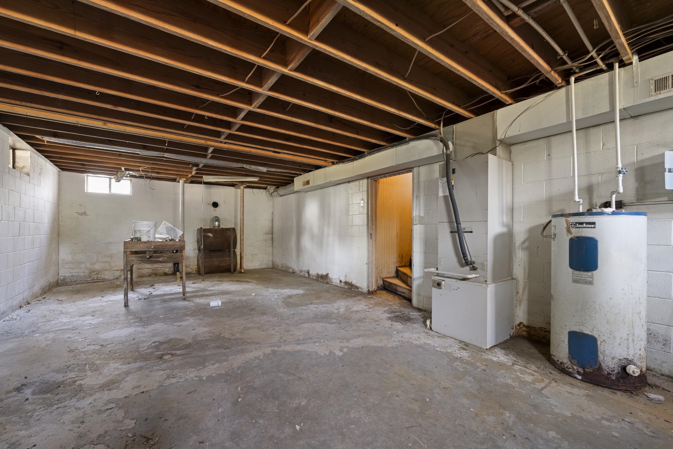 7285 Peavine Road Middleton, TN 38052 - Photo 22 of 35 Basement with electric water heater and heating unit