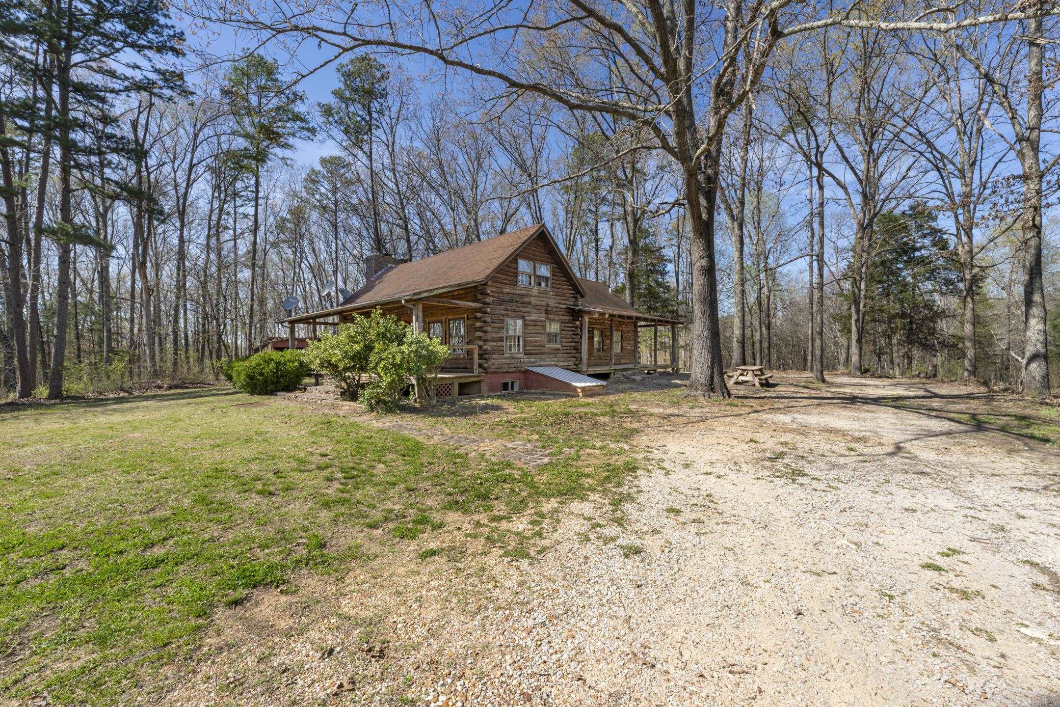 7285 Peavine Road Middleton, TN 38052 - Photo 24 of 35 View of side of home featuring a yard and log exterior