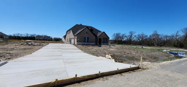 a view of a backyard of the house