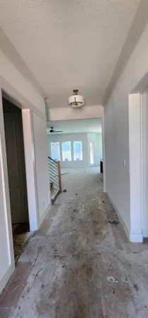 a view of a big room with window and hardwood floor