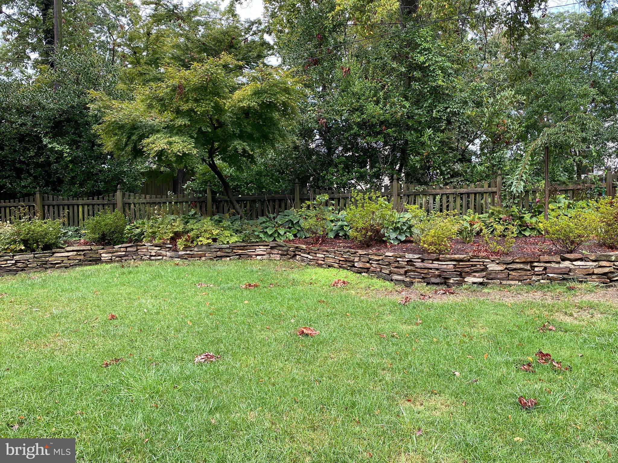 6902 Kenleigh Road Baltimore, MD 21212 - Photo 4 of 12 Gorgeous stacked stone wall at the back of the yar