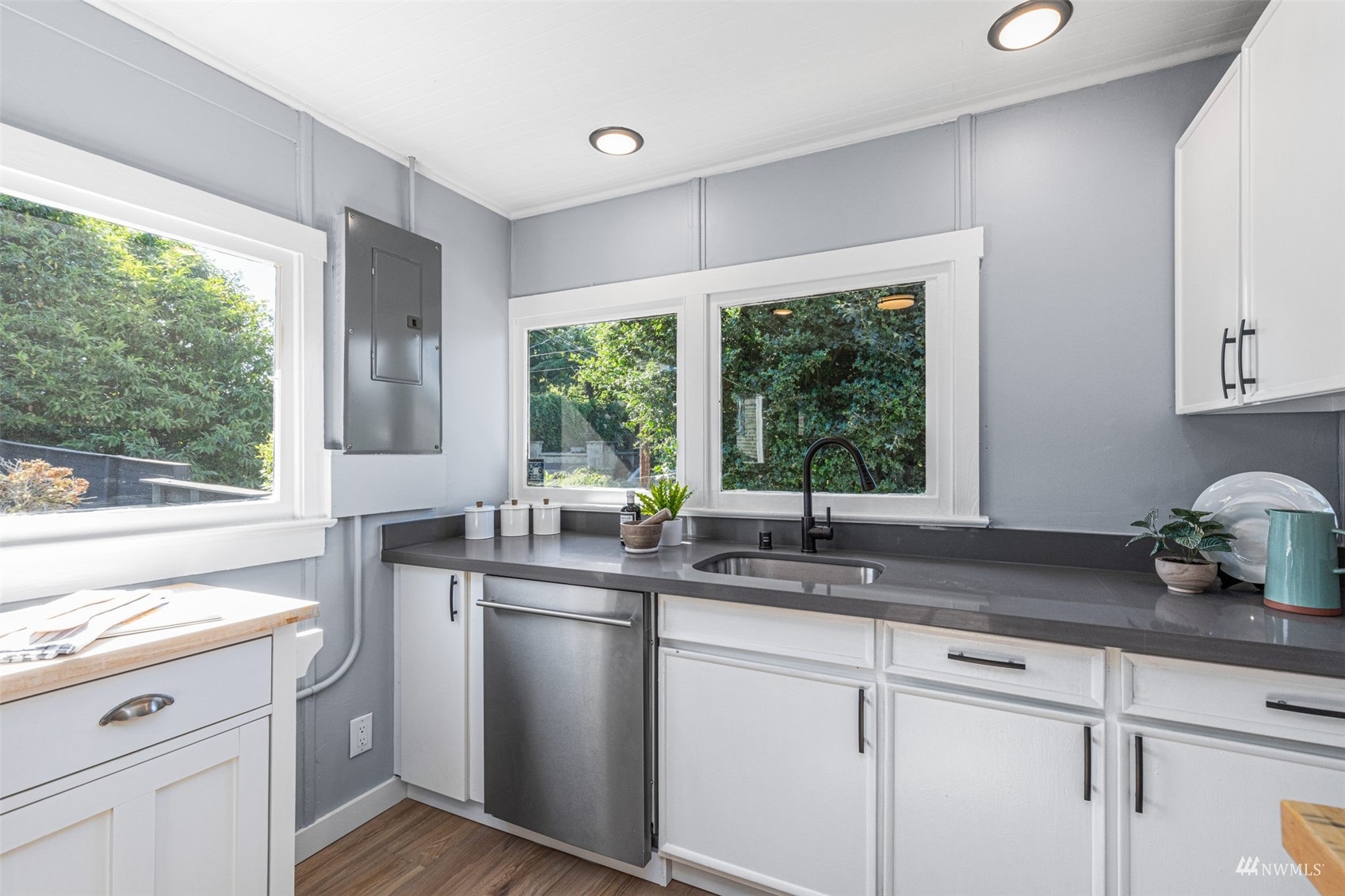 1542 30th Avenue South Seattle, WA 98144 - Photo 11 of 39 a kitchen with stainless steel appliances a sink a stove and a window