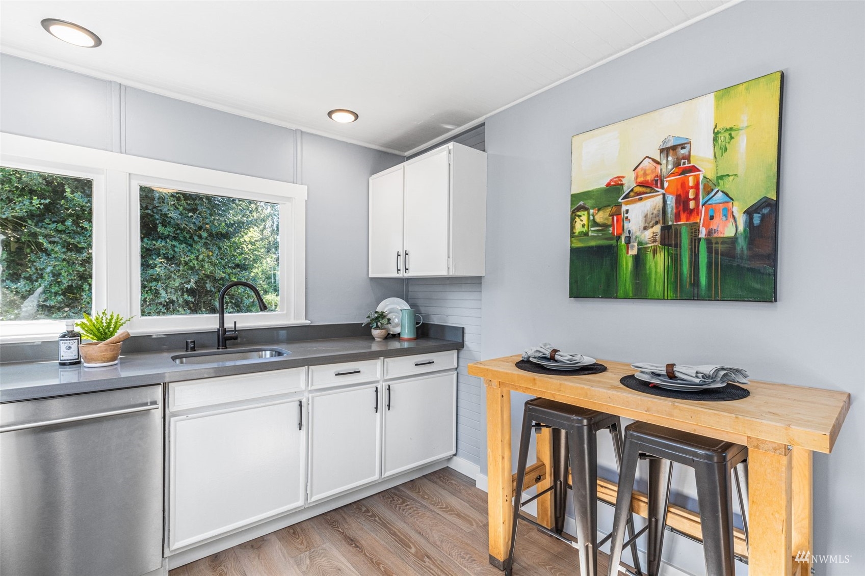 1542 30th Avenue South Seattle, WA 98144 - Photo 12 of 39 a kitchen with stainless steel appliances a stove a sink and a refrigerator