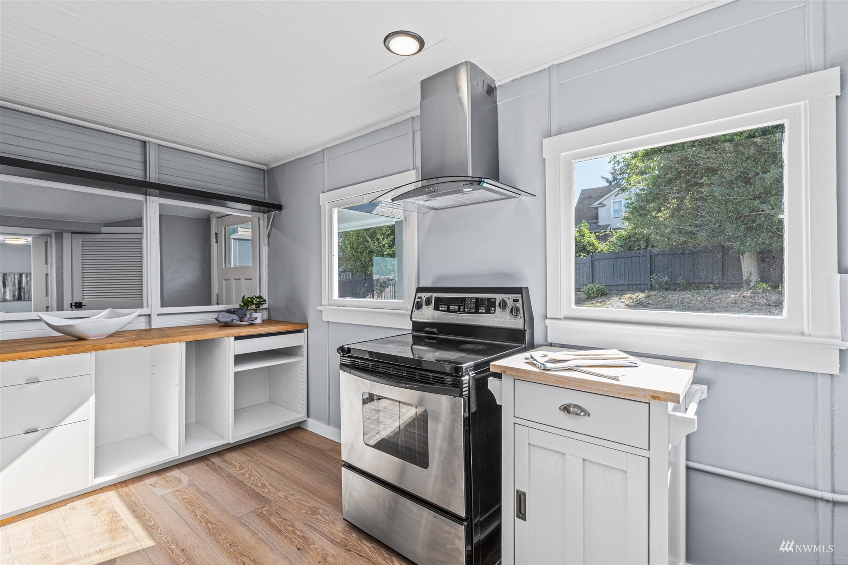 1542 30th Avenue South Seattle, WA 98144 - Photo 14 of 39 a kitchen with a stove a sink and a refrigerator