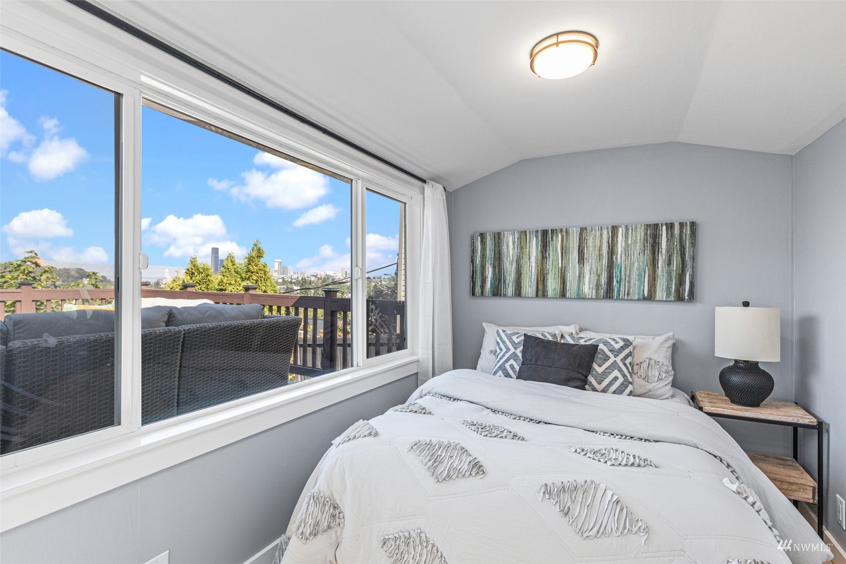 1542 30th Avenue South Seattle, WA 98144 - Photo 16 of 39 a bedroom with a large bed and a large window