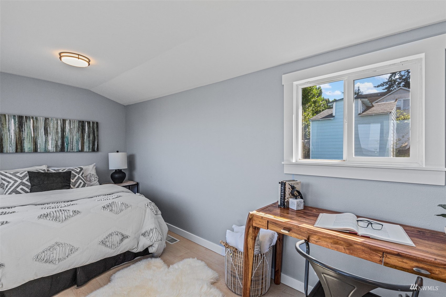 1542 30th Avenue South Seattle, WA 98144 - Photo 18 of 39 a bedroom with a bed and a table