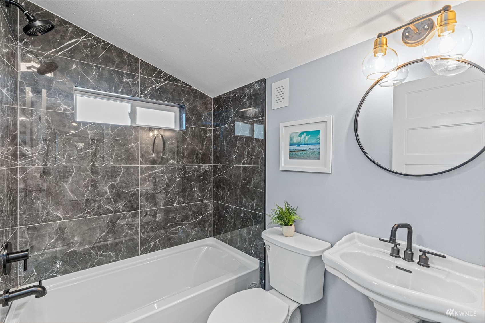1542 30th Avenue South Seattle, WA 98144 - Photo 19 of 39 a bathroom with a sink mirror bathtub and toilet