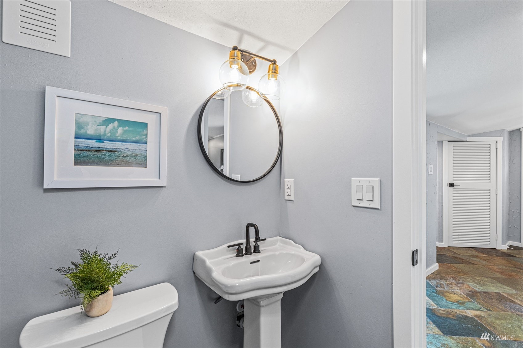 1542 30th Avenue South Seattle, WA 98144 - Photo 20 of 39 a bathroom with a sink and a mirror