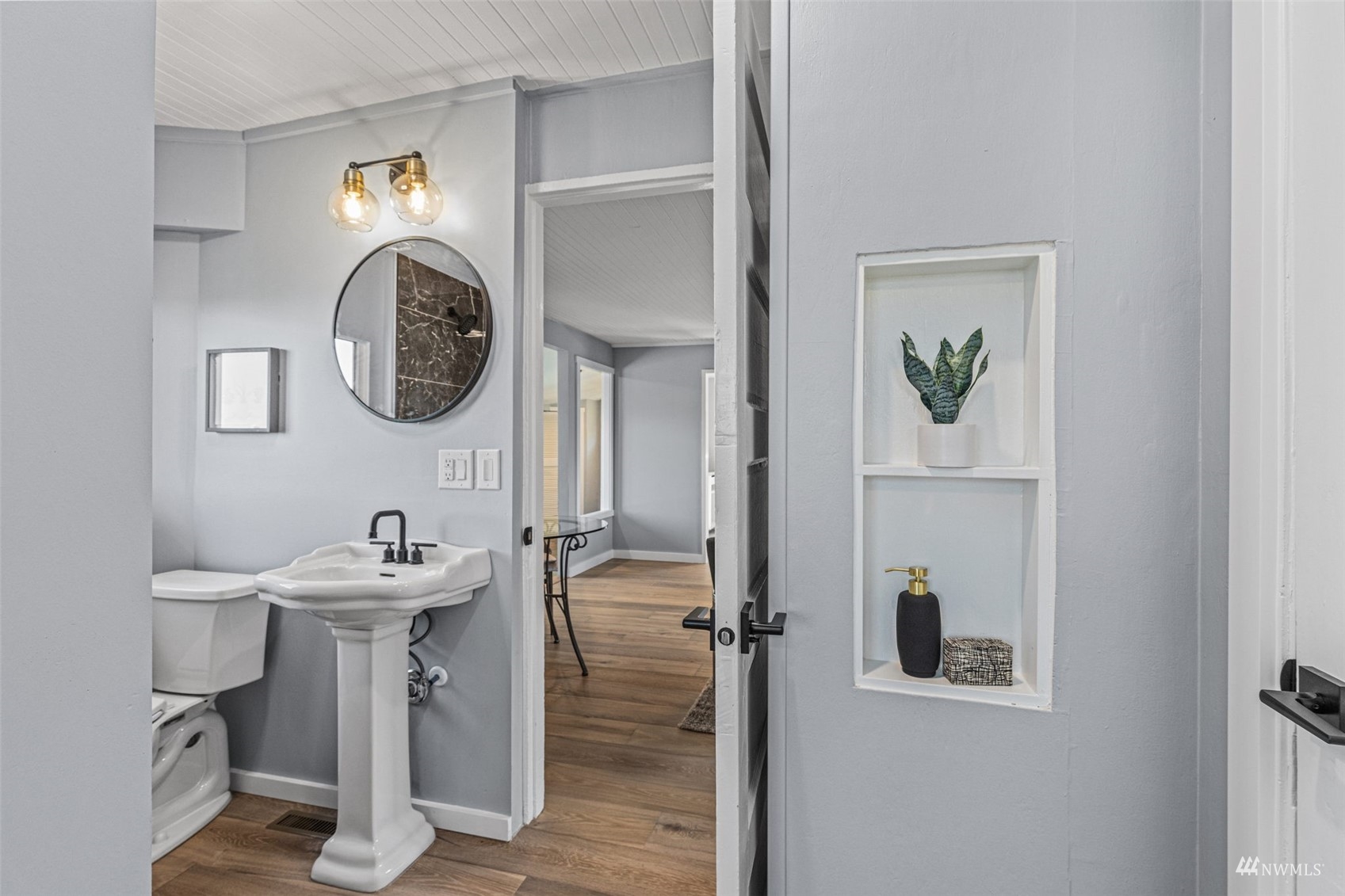 1542 30th Avenue South Seattle, WA 98144 - Photo 26 of 39 a bathroom with a sink and a mirror
