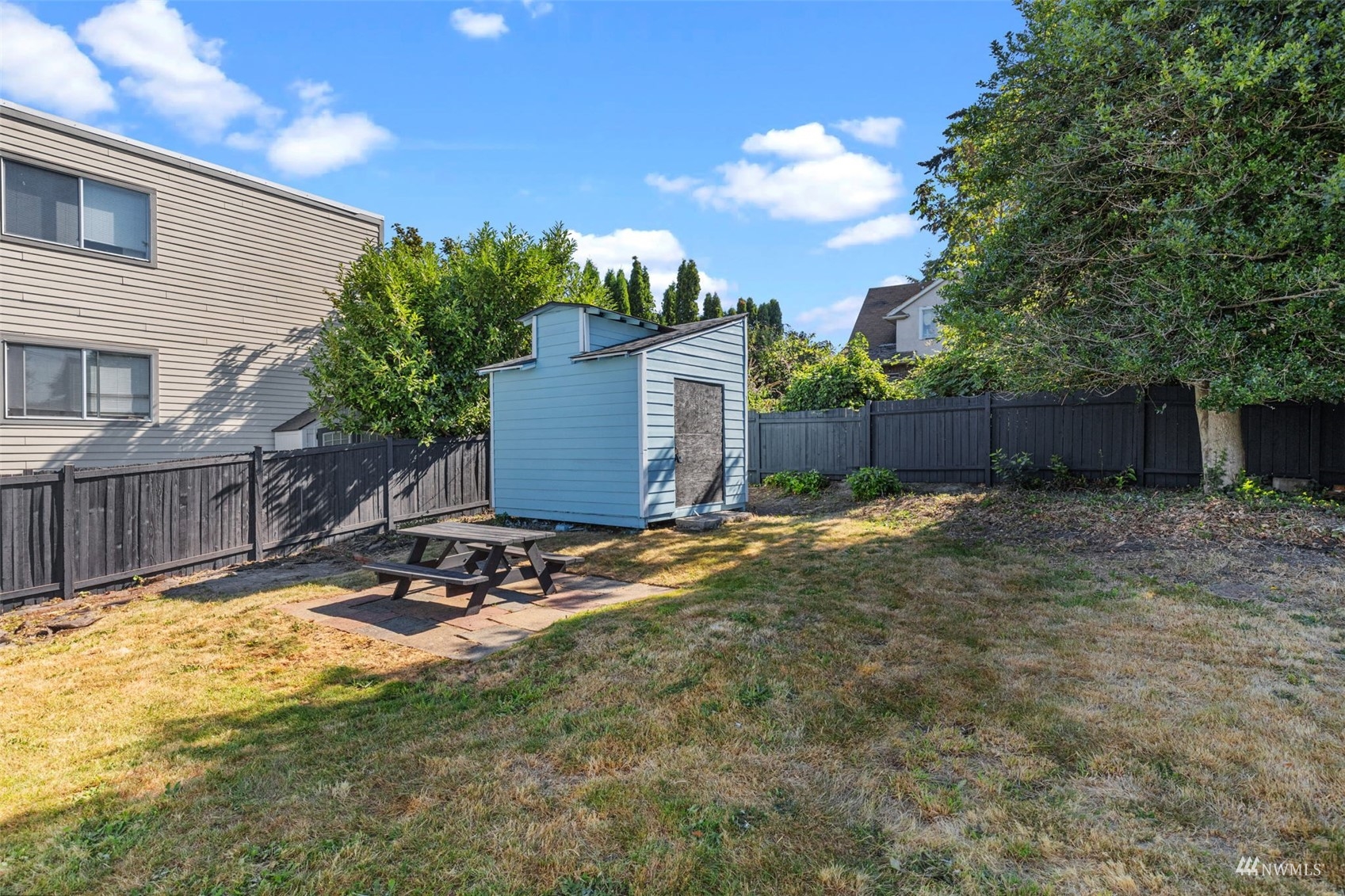1542 30th Avenue South Seattle, WA 98144 - Photo 34 of 39 a backyard of a house with table and chairs