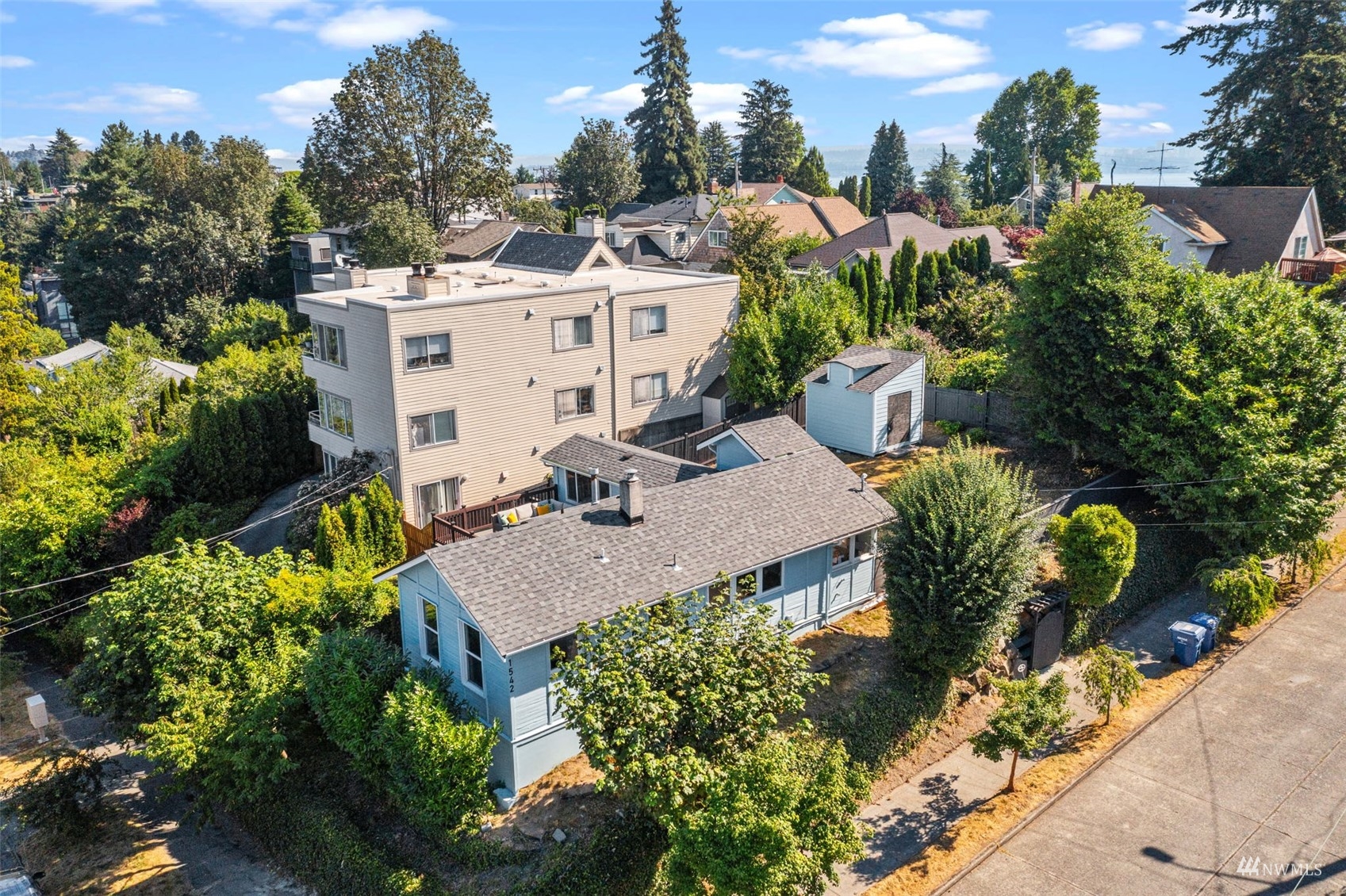 1542 30th Avenue South Seattle, WA 98144 - Photo 35 of 39 a view of a house with a yard and garden in the background