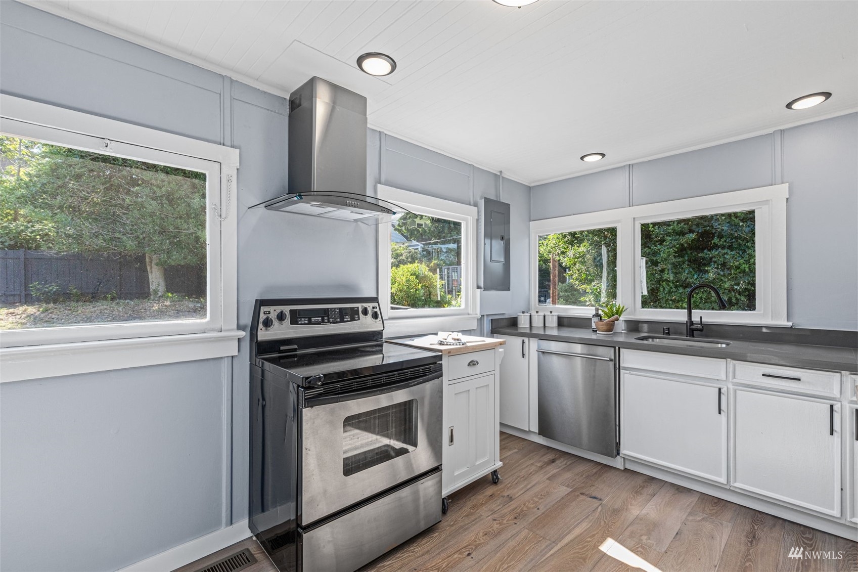 1542 30th Avenue South Seattle, WA 98144 - Photo 10 of 39 a kitchen with a stove a sink and a microwave
