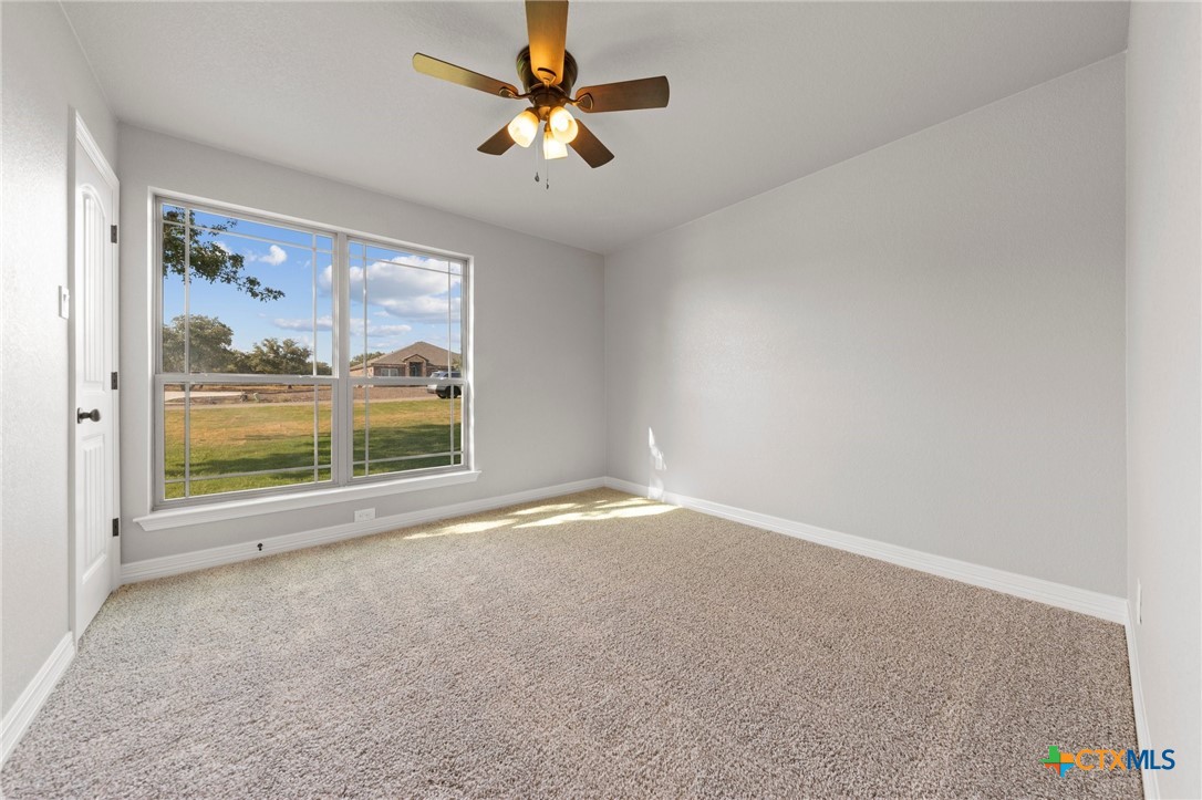 3030 Millhouse Road Copperas Cove, TX 76522 - Photo 11 of 24 an empty room with windows and fan