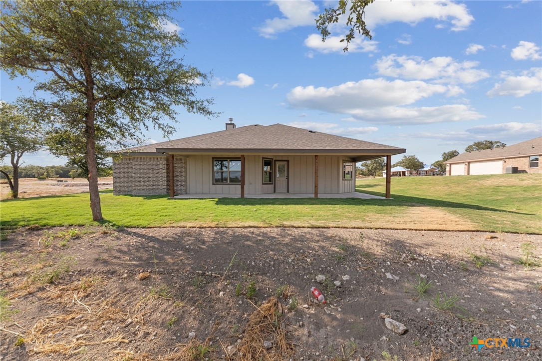3030 Millhouse Road Copperas Cove, TX 76522 - Photo 14 of 24 a view of a house with a backyard
