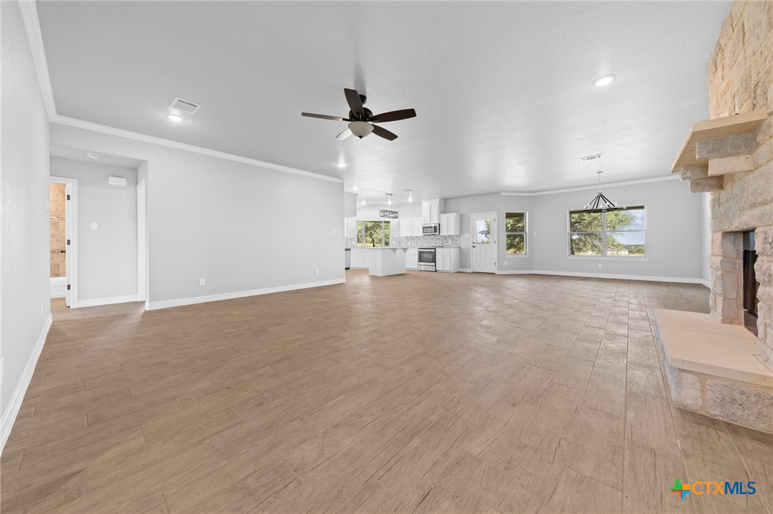 3030 Millhouse Road Copperas Cove, TX 76522 - Photo 16 of 24 an empty room with ceiling fan and windows