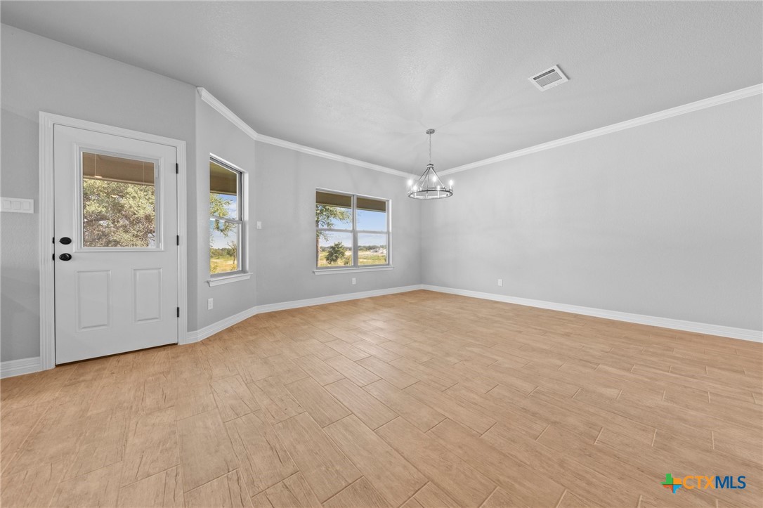 3030 Millhouse Road Copperas Cove, TX 76522 - Photo 24 of 24 an empty room with windows and ceiling fan