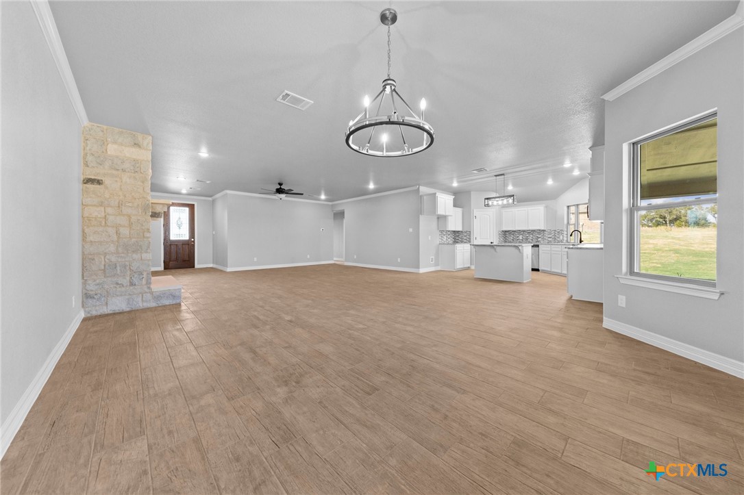 3030 Millhouse Road Copperas Cove, TX 76522 - Photo 7 of 24 a view of a room with wooden floor and window