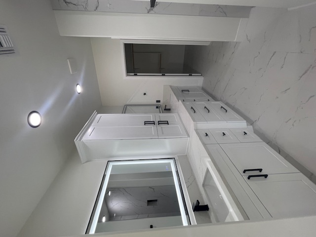 2367 Corwin Road Bullhead City, AZ 86442 - Photo 27 of 45 a bathroom with a double vanity sink and mirror