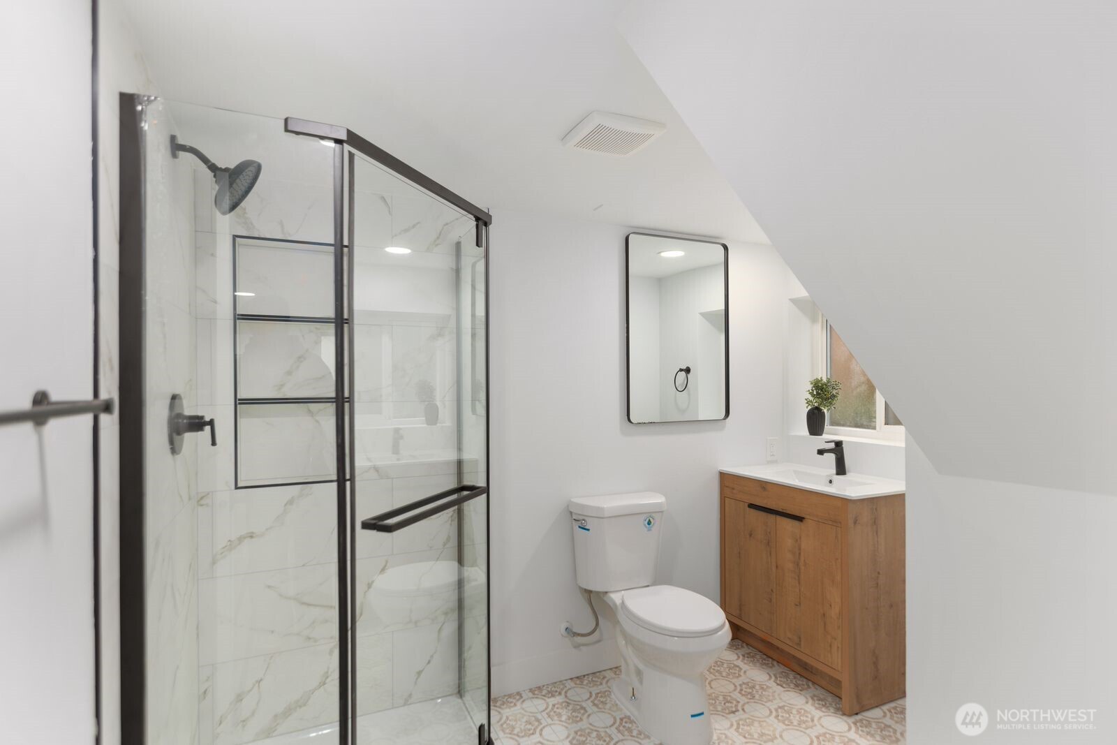 512 Northwest 44th Street Seattle, WA 98107 - Photo 23 of 37 a bathroom with a toilet sink and shower