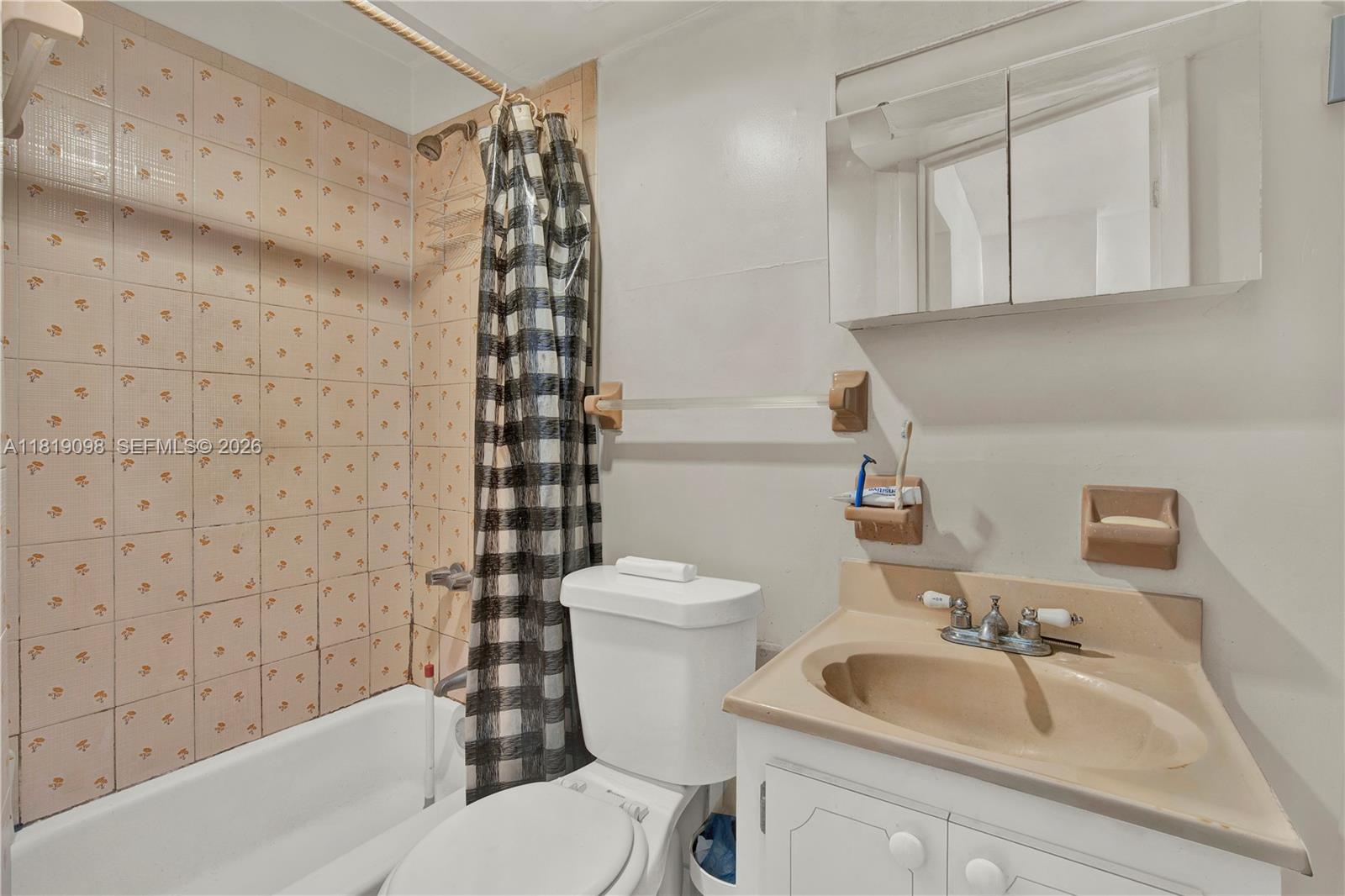 829 Southwest 19th Avenue Miami, FL 33135 - Photo 29 of 54 a bathroom with a sink a toilet and shower