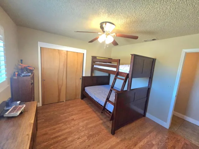 a room with wooden floor and stairs