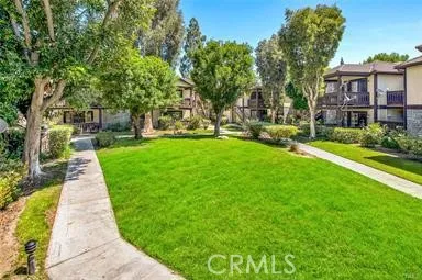 a view of street with tall buildings