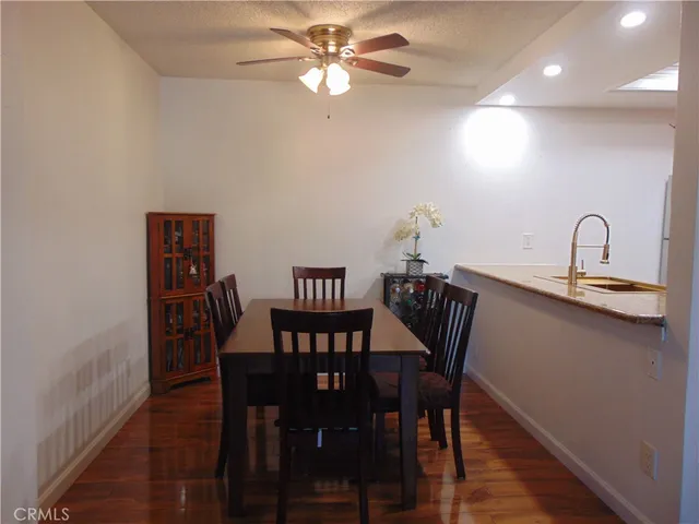 a view of a dining room with furniture and chandelier