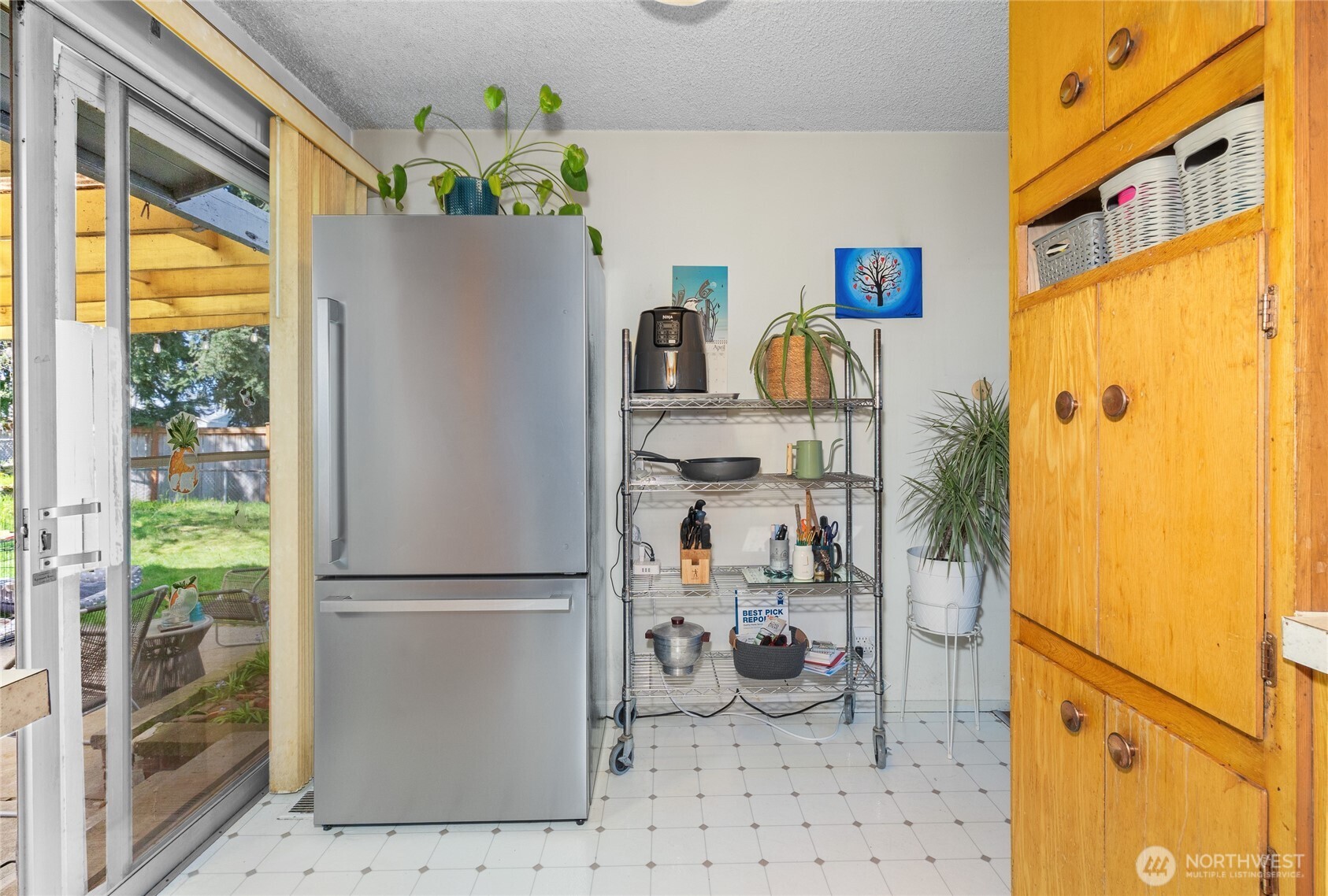 513 Harrington Avenue Northeast Renton, WA 98056 - Photo 11 of 33 a white refrigerator freezer sitting inside of a kitchen