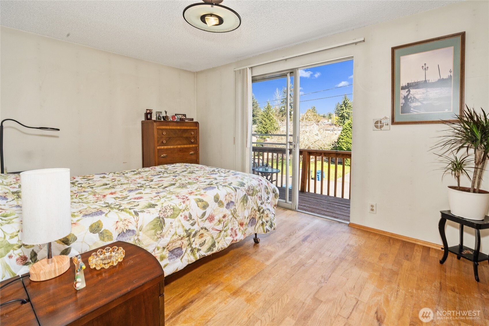 513 Harrington Avenue Northeast Renton, WA 98056 - Photo 13 of 33 a bedroom with a bed and a table in it
