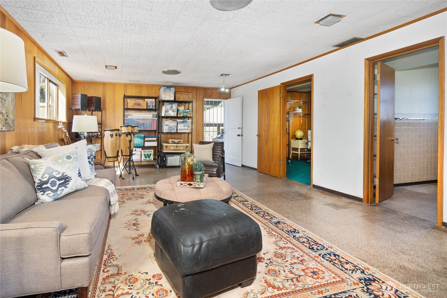 513 Harrington Avenue Northeast Renton, WA 98056 - Photo 21 of 33 a living room with furniture and a rug