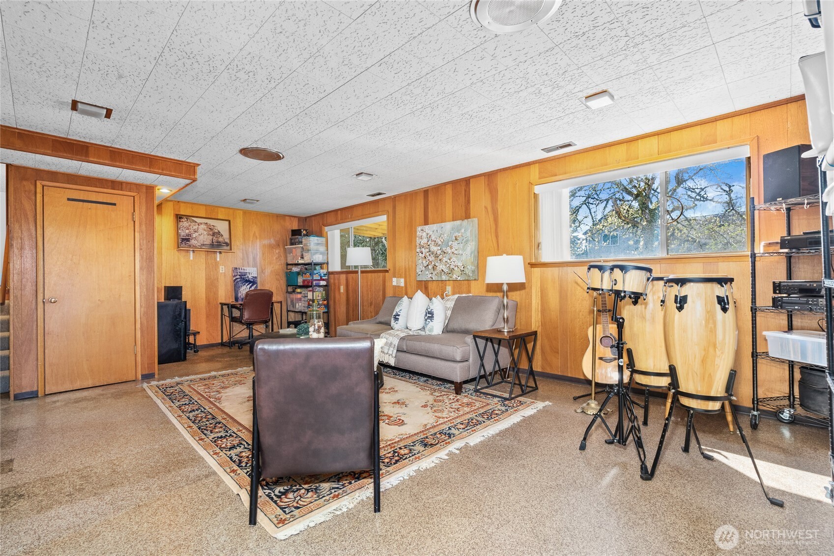 513 Harrington Avenue Northeast Renton, WA 98056 - Photo 22 of 33 a living room with furniture and a floor to ceiling window