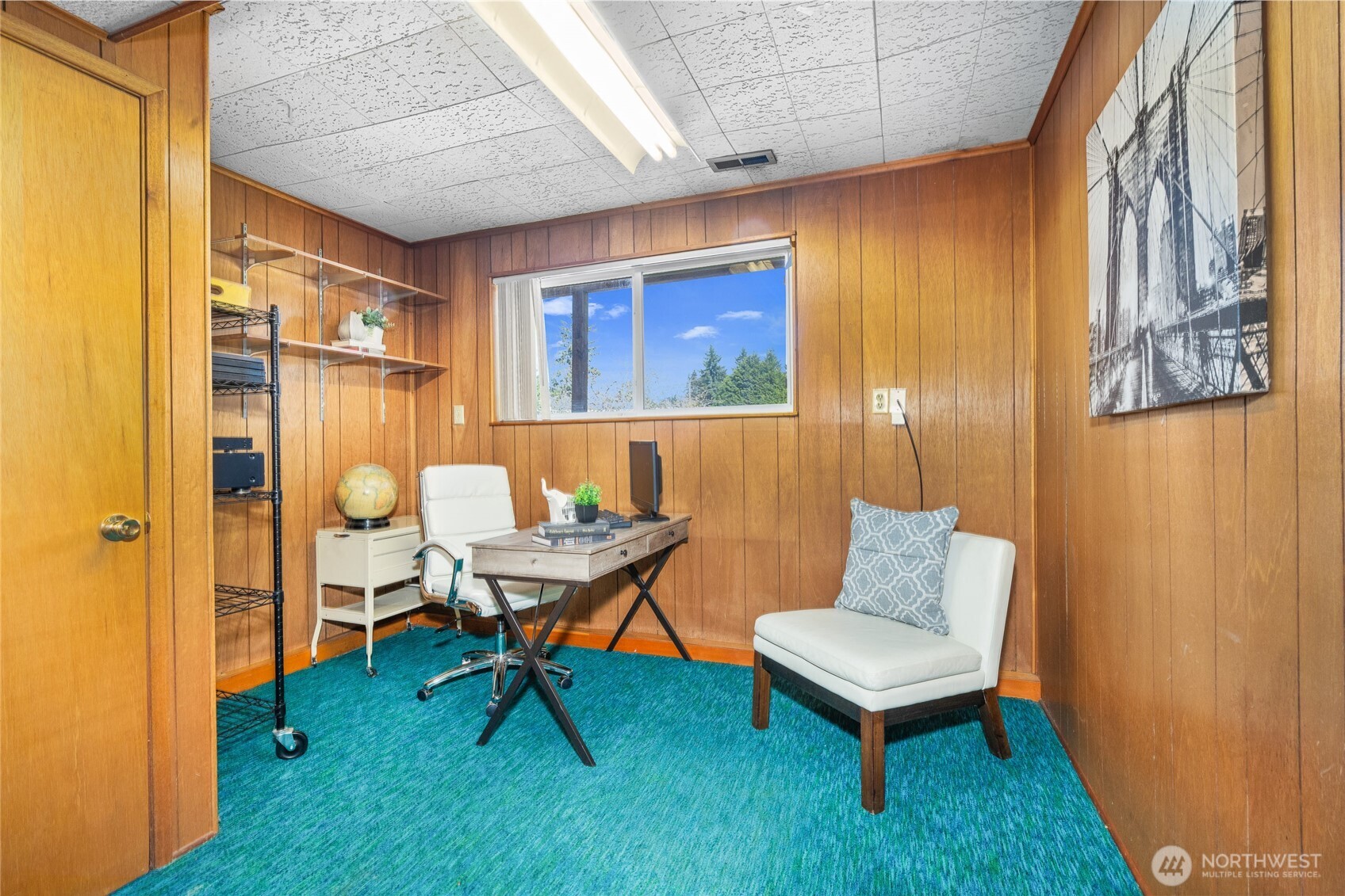 513 Harrington Avenue Northeast Renton, WA 98056 - Photo 23 of 33 a living room with furniture and a rug