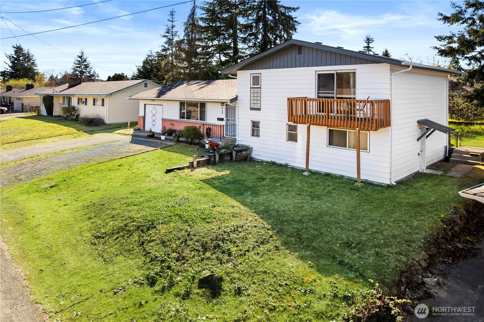 513 Harrington Avenue Northeast Renton, WA 98056 - Photo 31 of 33 a view of a house with a yard