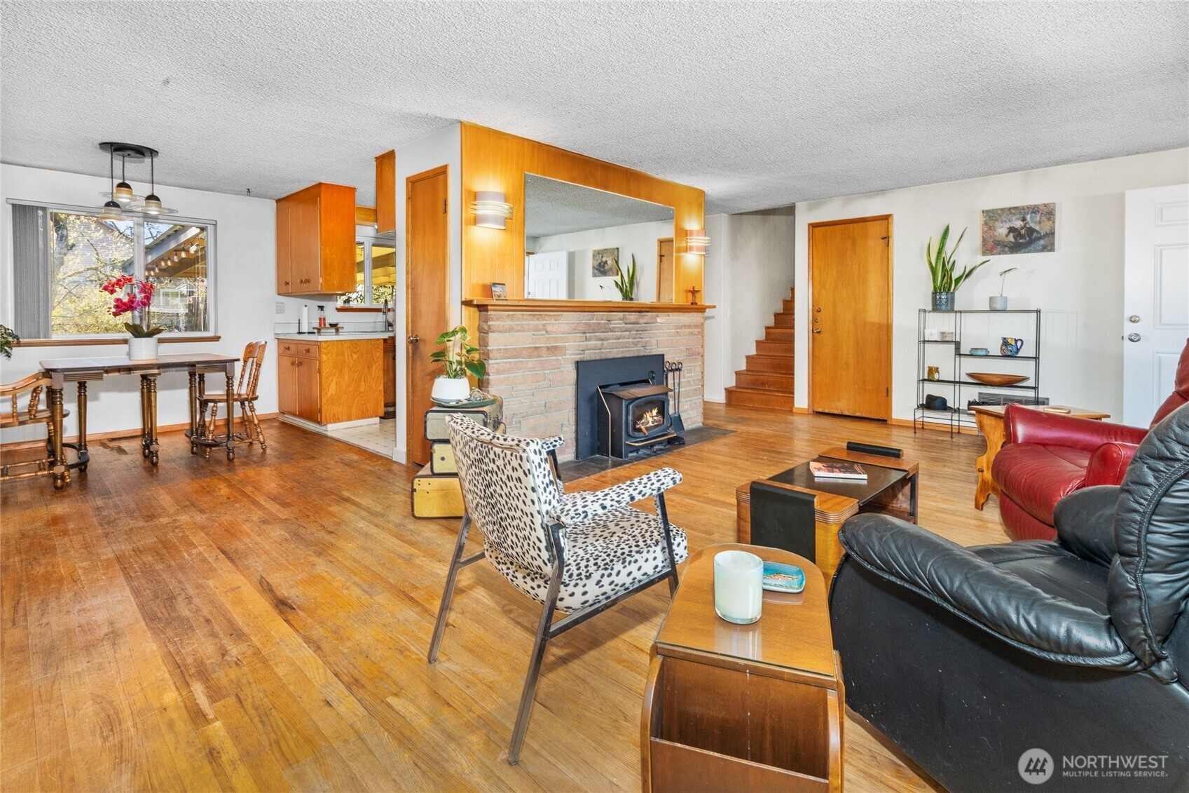 513 Harrington Avenue Northeast Renton, WA 98056 - Photo 6 of 33 a living room with fireplace furniture and a window