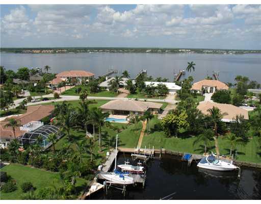 112 Northwest S Shore Road Stuart, FL 34994 - Photo 1 of 16 an aerial view of a house with a lake view