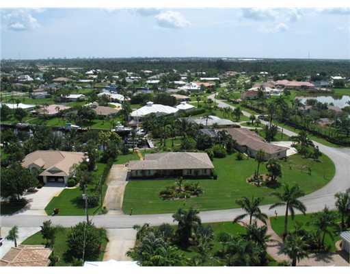 112 Northwest S Shore Road Stuart, FL 34994 - Photo 16 of 16 an aerial view of residential houses with outdoor space and trees