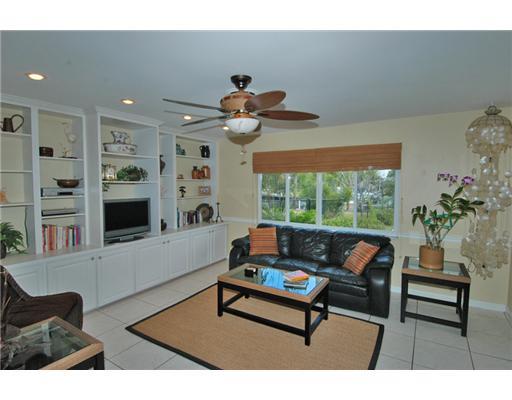112 Northwest S Shore Road Stuart, FL 34994 - Photo 5 of 16 a living room with furniture and a large window